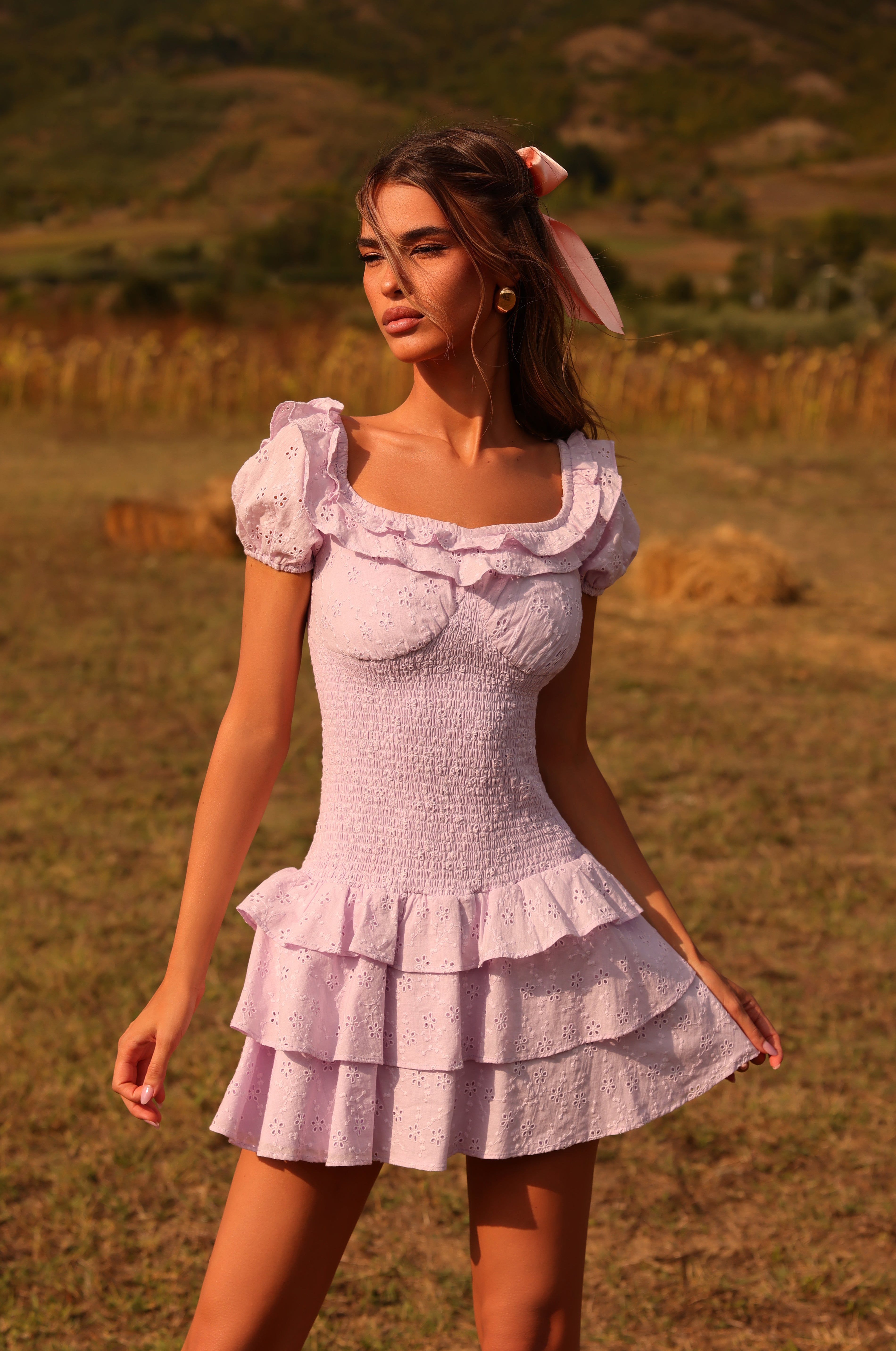 Orchid petal eyelet mini dress with puff sleeves and ruffle hem