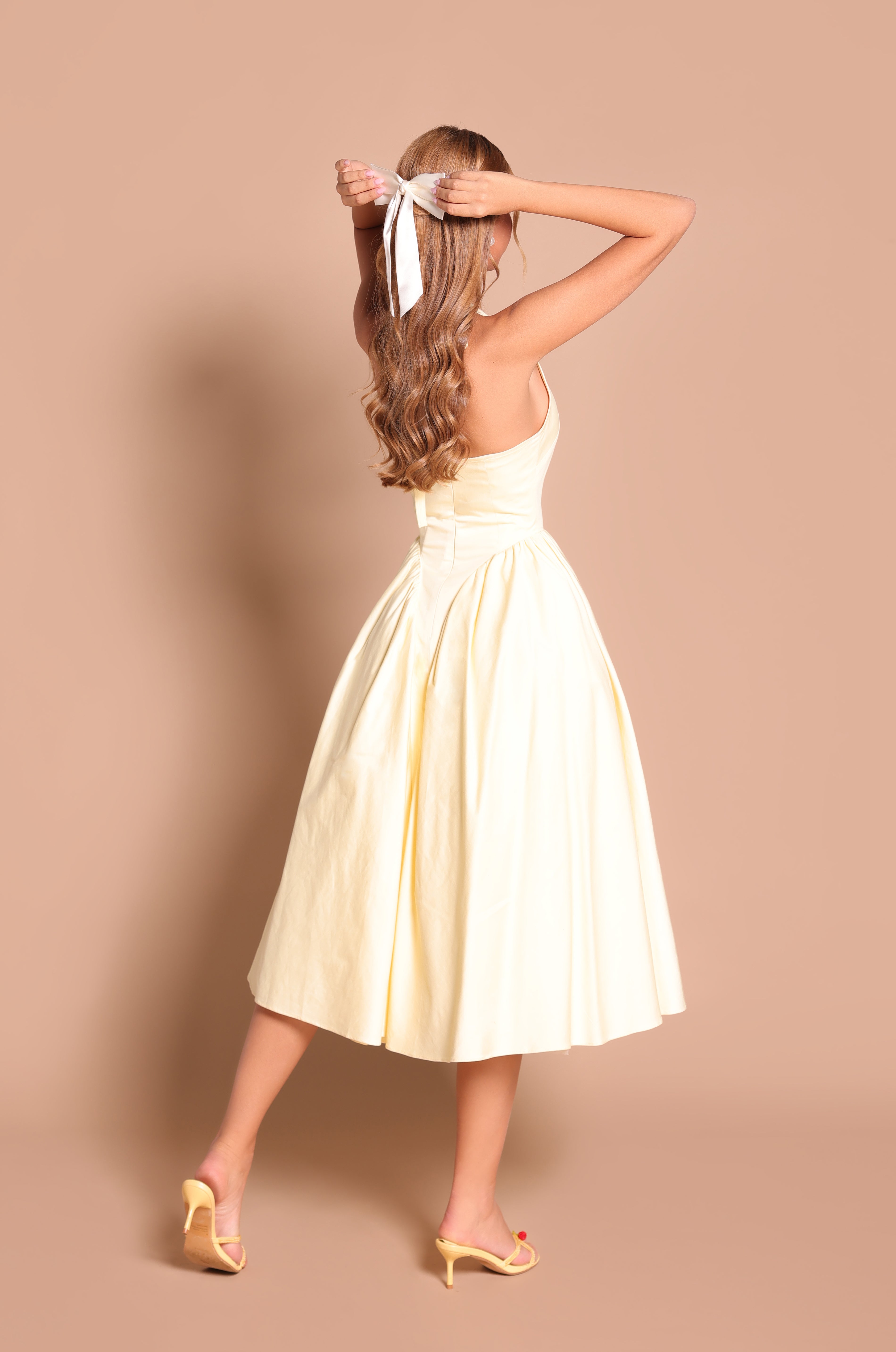 Buttercream Yellow halter midi dress with fitted waist 