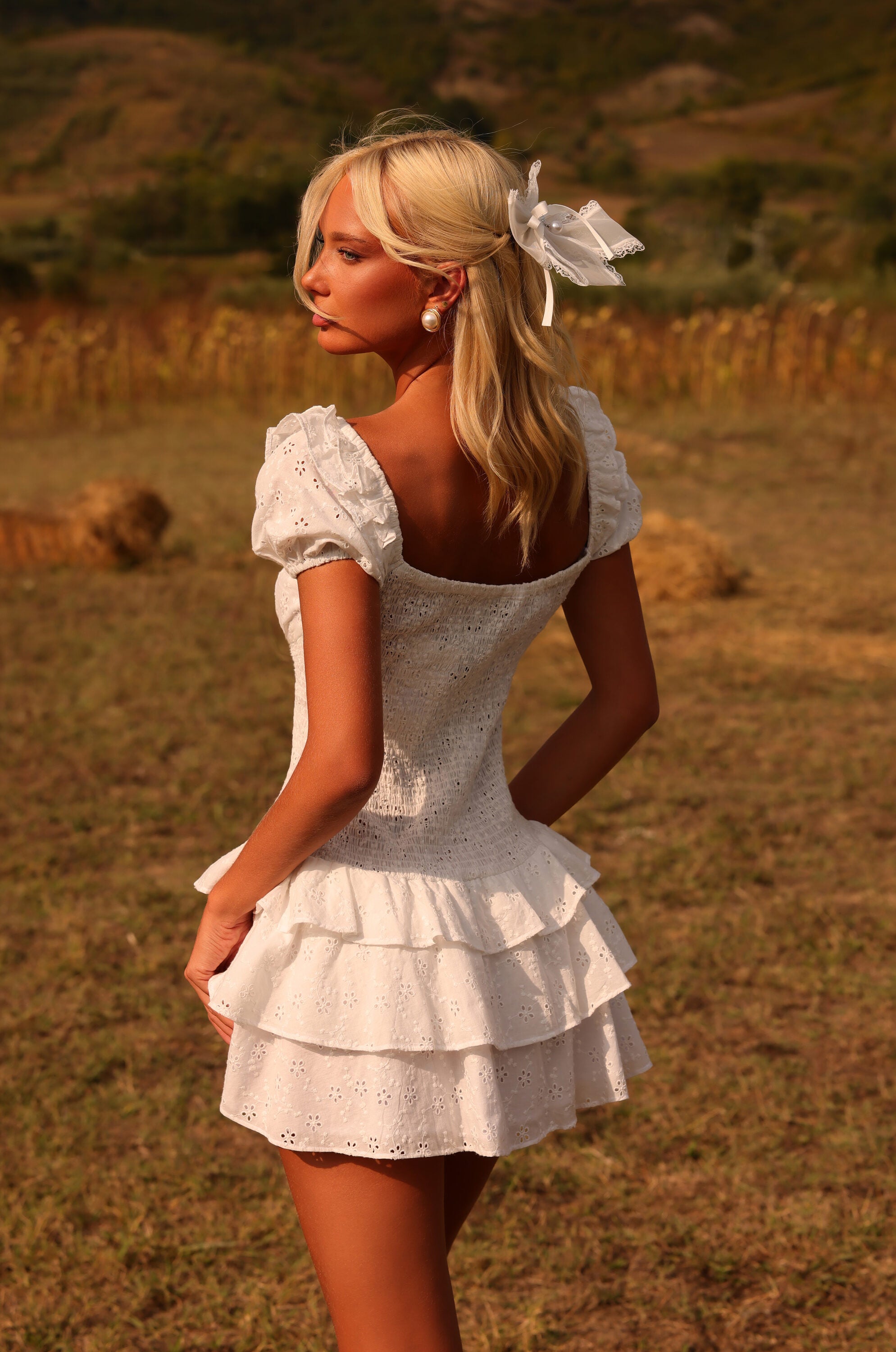 Ivory white mini dress with puff sleeves and ruffle hem 