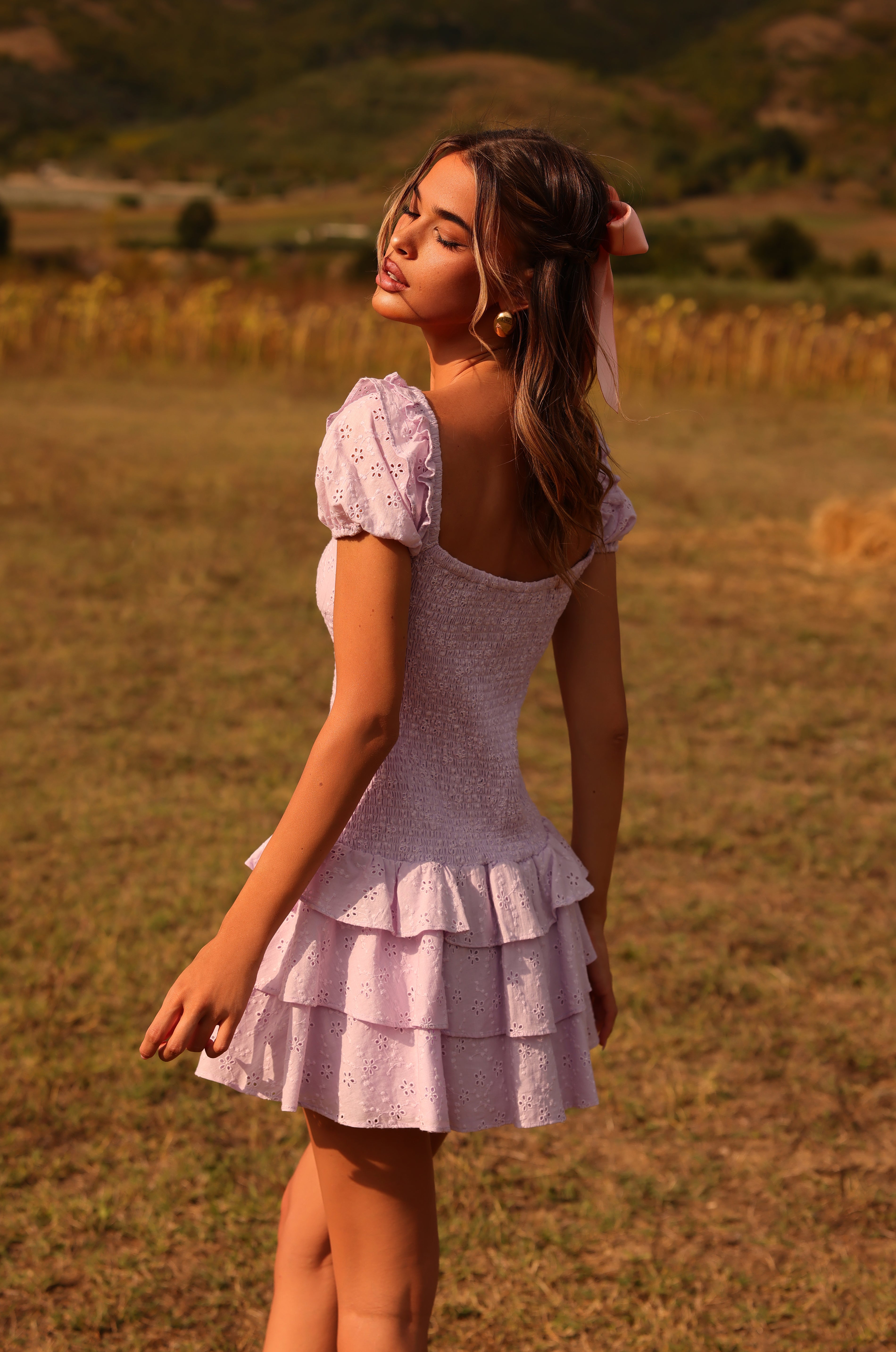 Orchid petal eyelet mini dress with puff sleeves and ruffle hem 