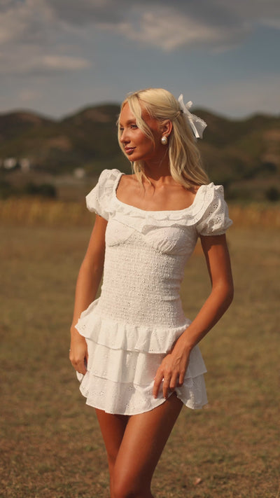 Ivory white mini dress with puff sleeves and ruffle hem 